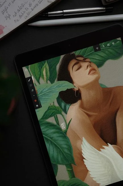 Businesswoman working on laptop with Android 6.0 Marshmallow webpage open.